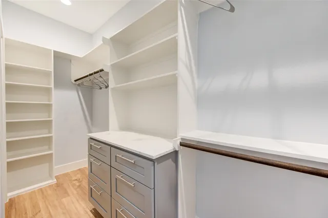 a utility room with cabinets washer and dryer