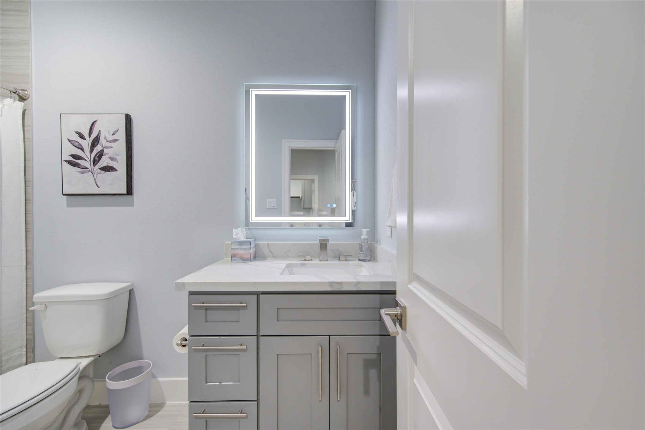 10021 Alfred Lane, Unit B Houston, TX 77041 - Photo 31 of 46 a bathroom with a granite countertop sink mirror vanity and toilet