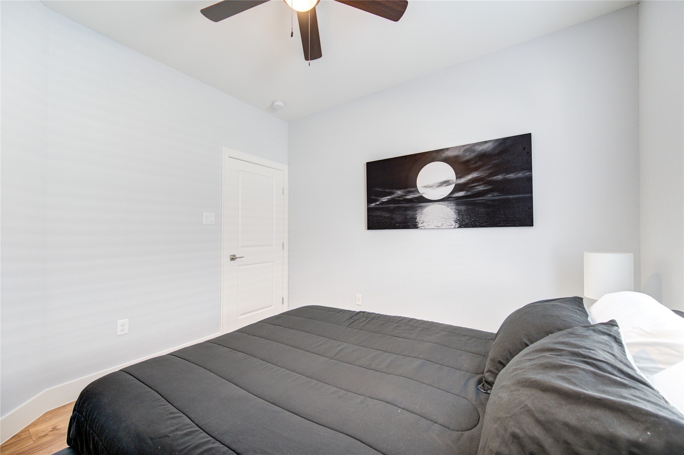10021 Alfred Lane, Unit B Houston, TX 77041 - Photo 37 of 46 a bedroom with a bed and a lamp on the dresser
