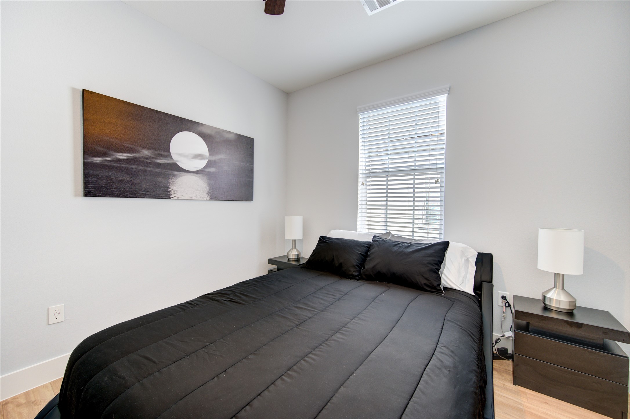 10021 Alfred Lane, Unit B Houston, TX 77041 - Photo 38 of 46 a bedroom with a bed and wooden floor