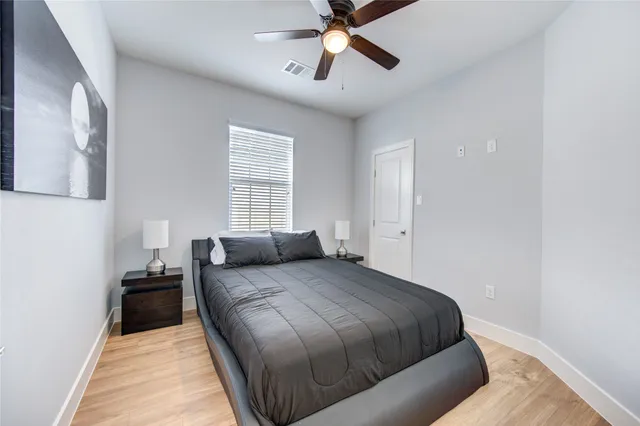 a bedroom with a bed and window