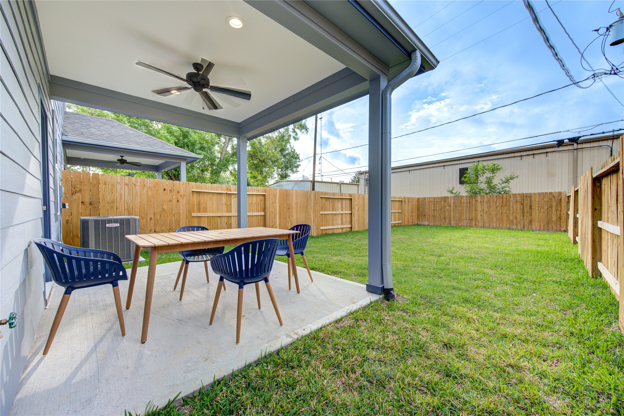 10021 Alfred Lane, Unit B Houston, TX 77041 - Photo 46 of 46 a view of a patio with a table chairs and a backyard