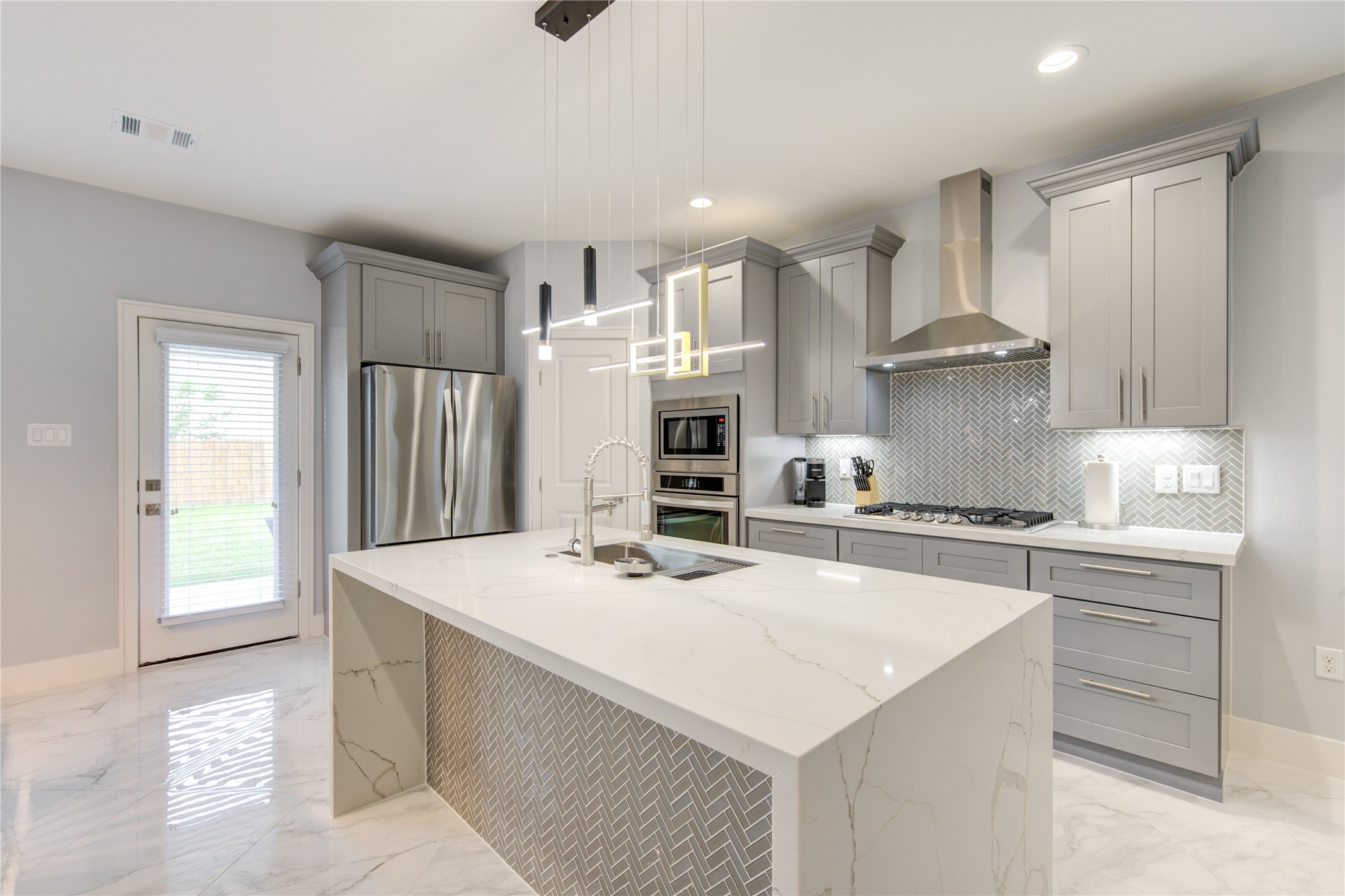 10021 Alfred Lane, Unit B Houston, TX 77041 - Photo 8 of 46 a kitchen with stainless steel appliances kitchen island a sink stove and cabinets