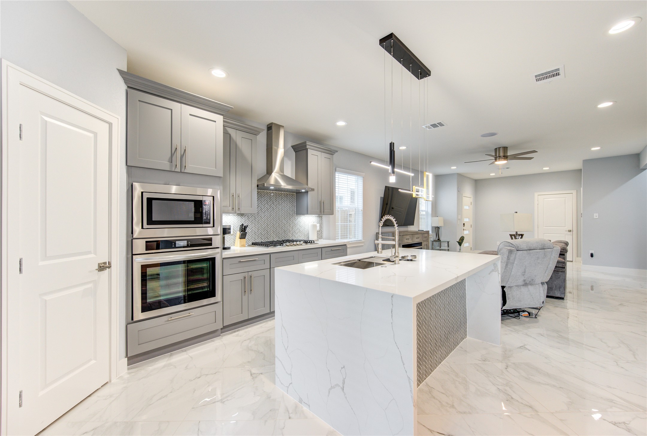 10021 Alfred Lane, Unit B Houston, TX 77041 - Photo 9 of 46 a kitchen with a sink stainless steel appliances and cabinets
