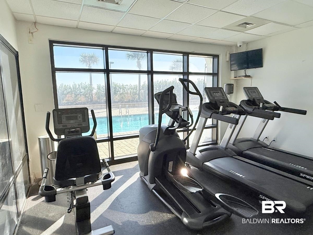 27284 Gulf Road, Unit 212 Orange Beach, AL 36561 - Photo 32 of 35 Gym with a drop ceiling