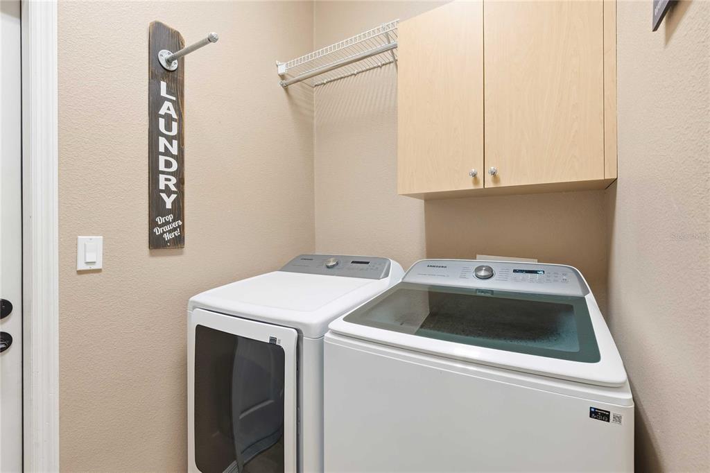 34106 Trilby Road Dade City, FL 33523 - Photo 12 of 39 a utility room with dryer and washer
