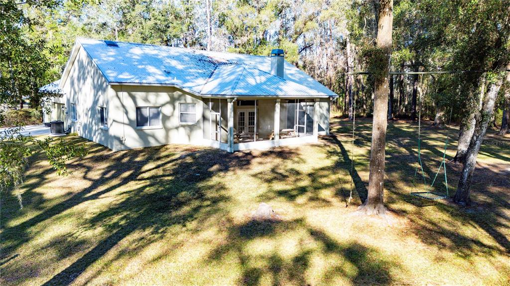 34106 Trilby Road Dade City, FL 33523 - Photo 18 of 39 a front view of a house with a yard