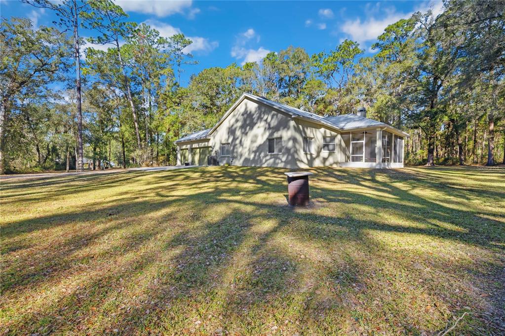 34106 Trilby Road Dade City, FL 33523 - Photo 33 of 39 a view of a house with a yard