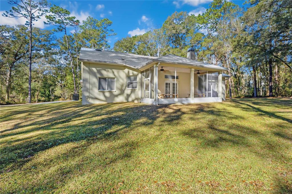 34106 Trilby Road Dade City, FL 33523 - Photo 34 of 39 a front view of a house with a garden