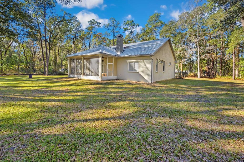 34106 Trilby Road Dade City, FL 33523 - Photo 35 of 39 a front view of a house with a yard