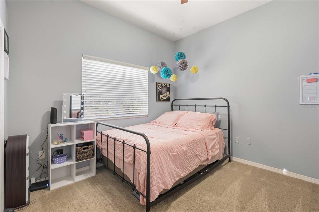 34106 Trilby Road Dade City, FL 33523 - Photo 8 of 39 a bedroom with a bed and a window