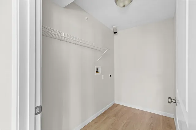a bathroom with a walk in closet and window