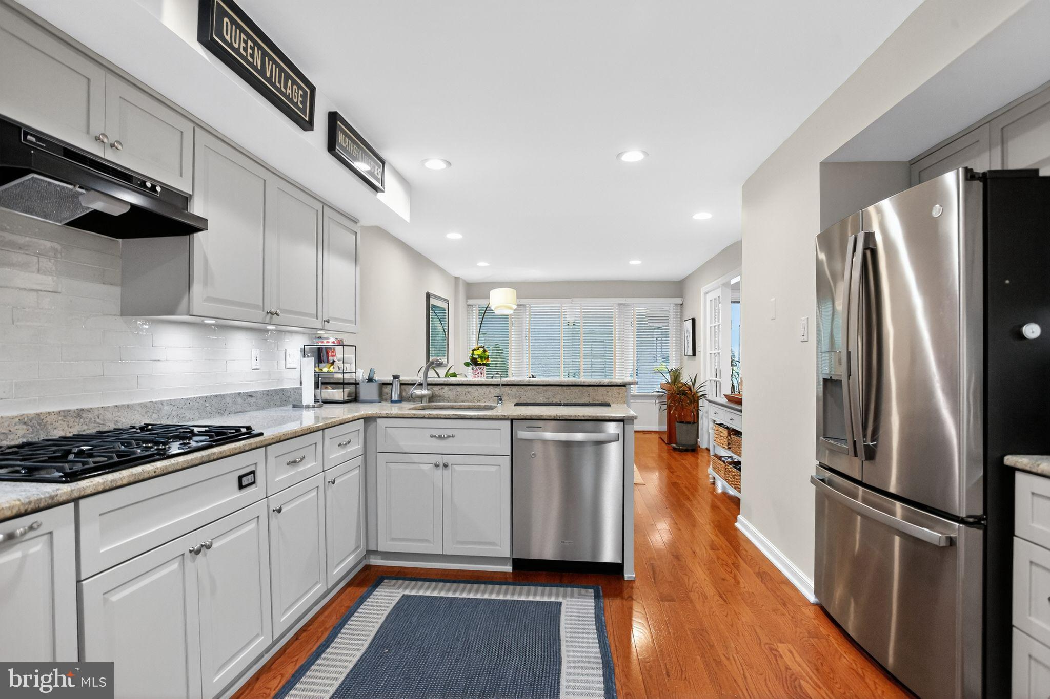 149 Splitrail Lane Blue Bell, PA 19422 - Photo 11 of 40 a kitchen with stainless steel appliances a refrigerator a sink a stove top oven a counter space and cabinets