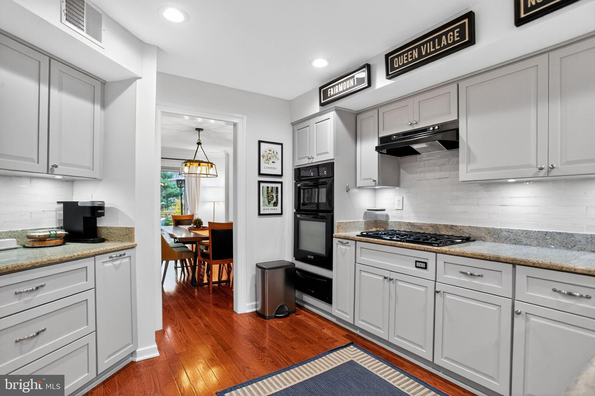 149 Splitrail Lane Blue Bell, PA 19422 - Photo 13 of 40 a kitchen with granite countertop cabinets stainless steel appliances and wooden floor