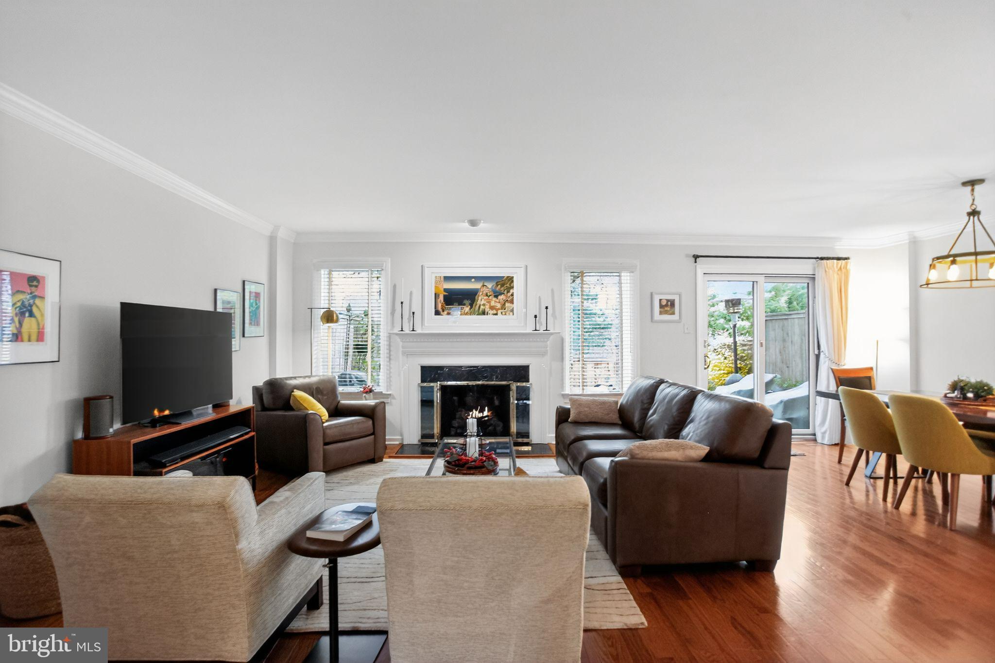 149 Splitrail Lane Blue Bell, PA 19422 - Photo 19 of 40 a living room with furniture a fireplace and a flat screen tv