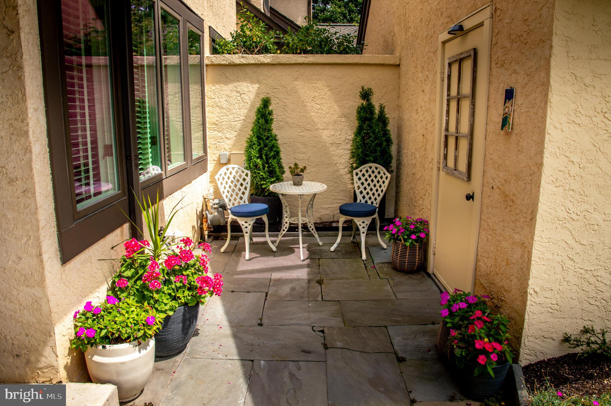 149 Splitrail Lane Blue Bell, PA 19422 - Photo 3 of 40 a view of a patio with dining table and chairs potted plants