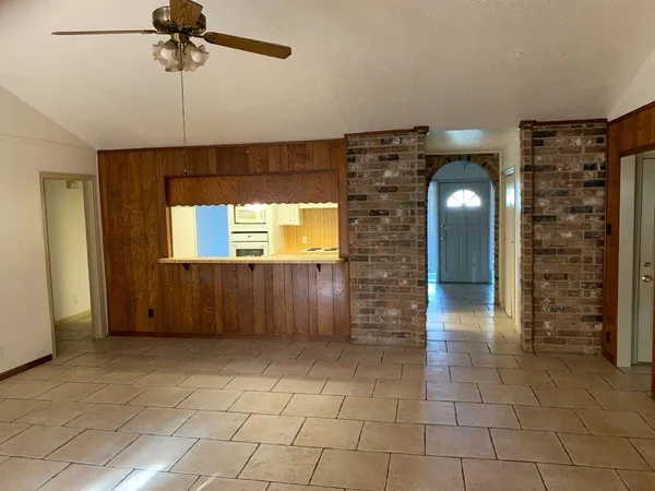 a view of empty room with windows