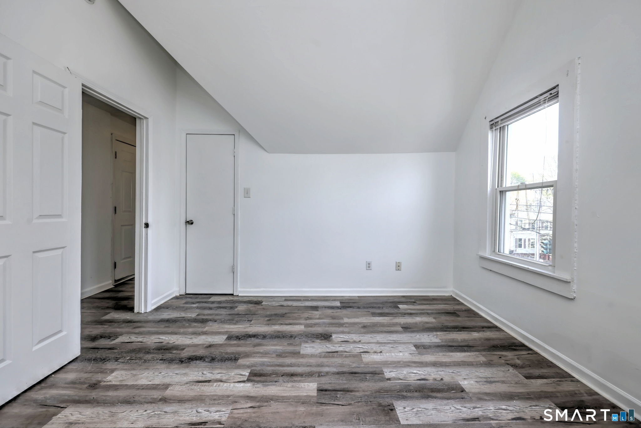 483 Ferry Street, Unit 3 New Haven, CT 06513 - Photo 11 of 28 a view of empty room with wooden floor and fan