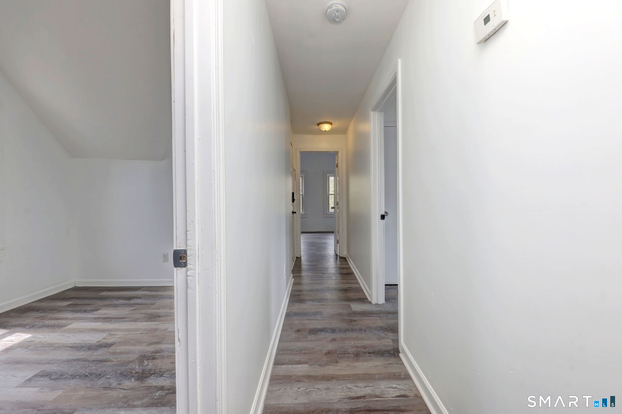 483 Ferry Street, Unit 3 New Haven, CT 06513 - Photo 13 of 28 a view of a hallway with wooden floor