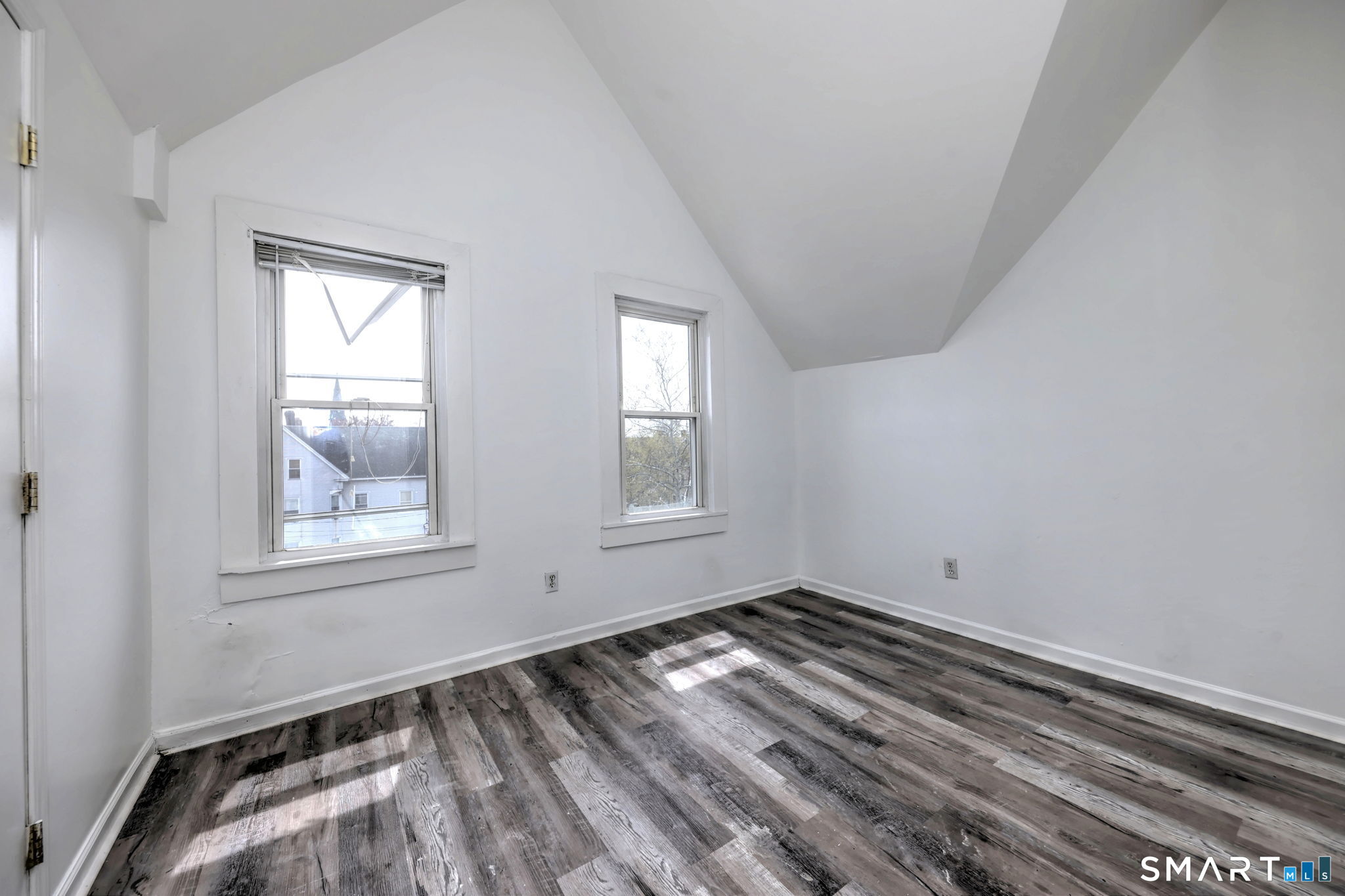 483 Ferry Street, Unit 3 New Haven, CT 06513 - Photo 14 of 28 a view of empty room with wooden floor and fan