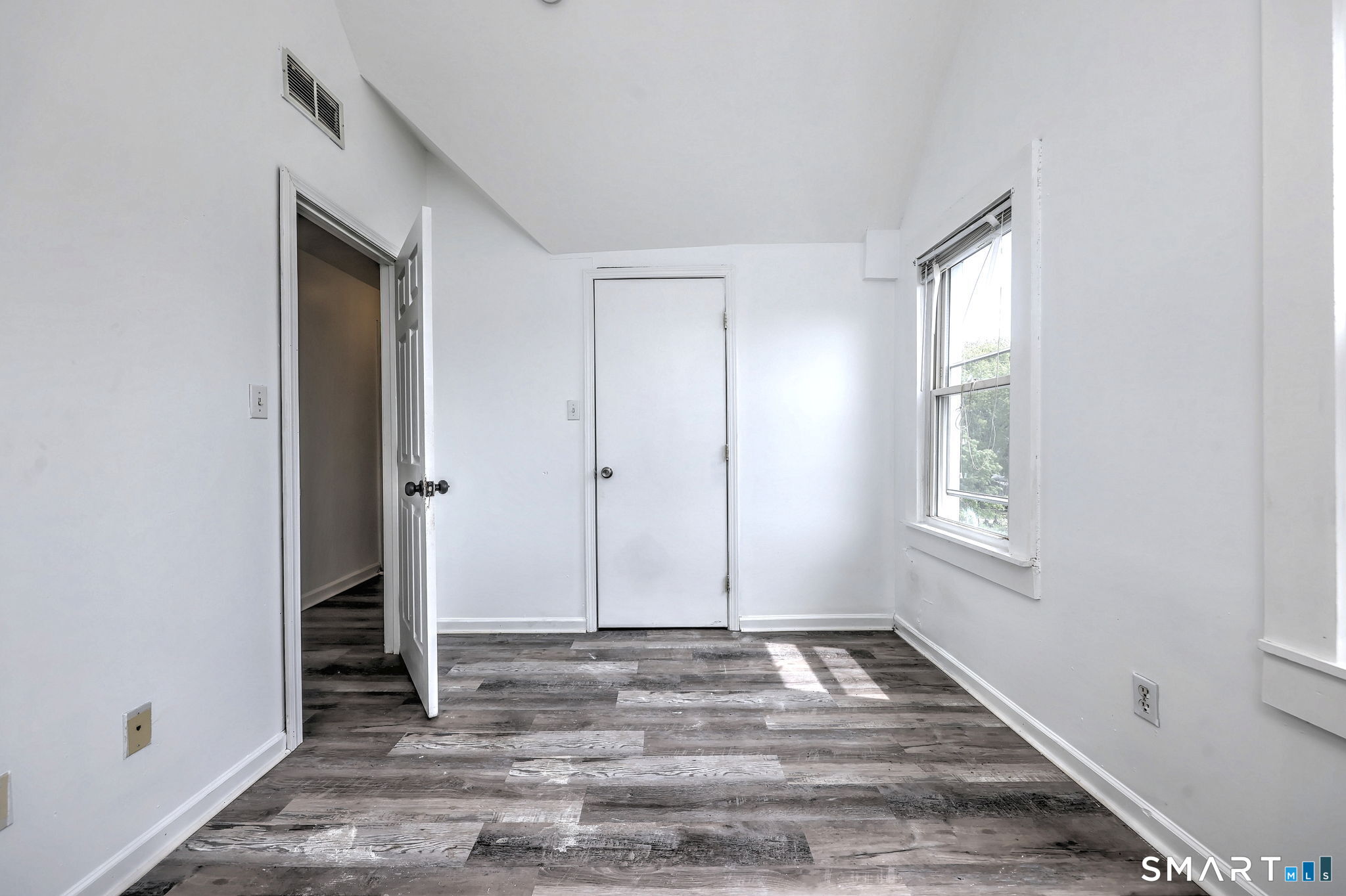 483 Ferry Street, Unit 3 New Haven, CT 06513 - Photo 15 of 28 a view of room with window and hardwood floor