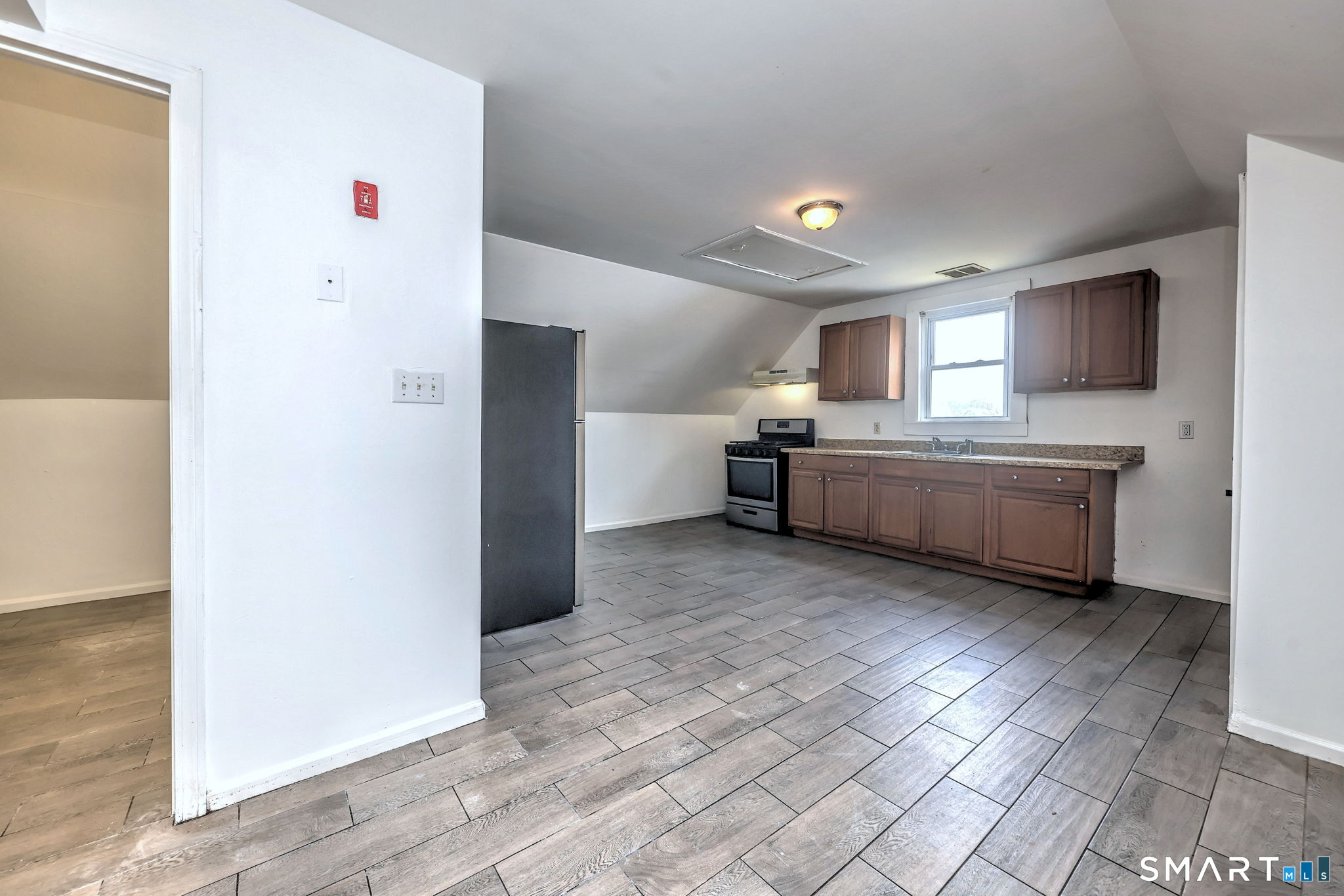 483 Ferry Street, Unit 3 New Haven, CT 06513 - Photo 18 of 28 a large kitchen with a refrigerator and a stove top oven