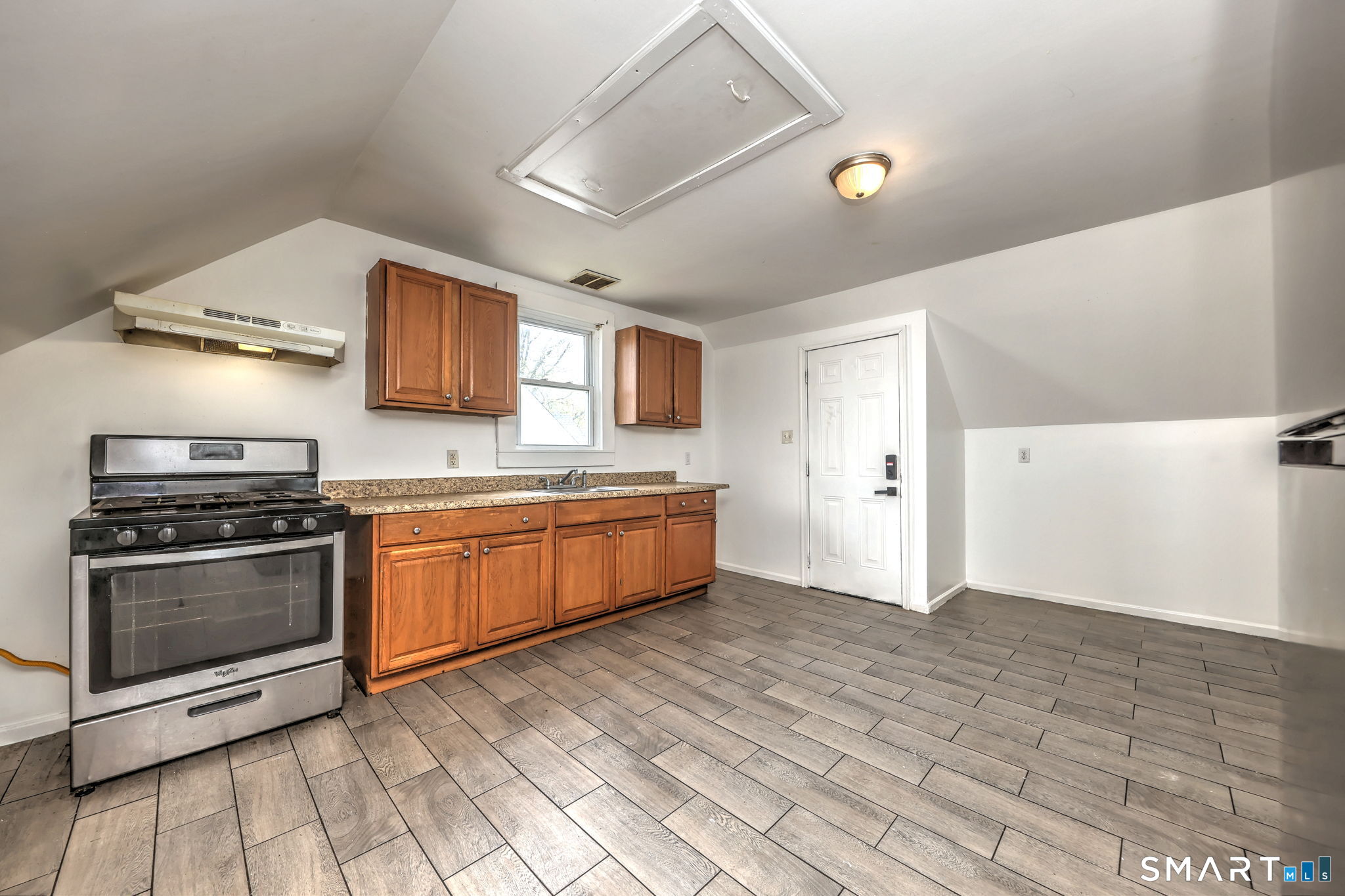 483 Ferry Street, Unit 3 New Haven, CT 06513 - Photo 21 of 28 a kitchen with stainless steel appliances a stove a sink and a refrigerator
