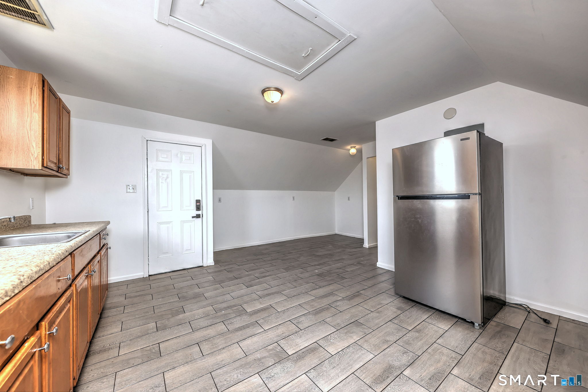483 Ferry Street, Unit 3 New Haven, CT 06513 - Photo 23 of 28 a kitchen with a refrigerator and a sink