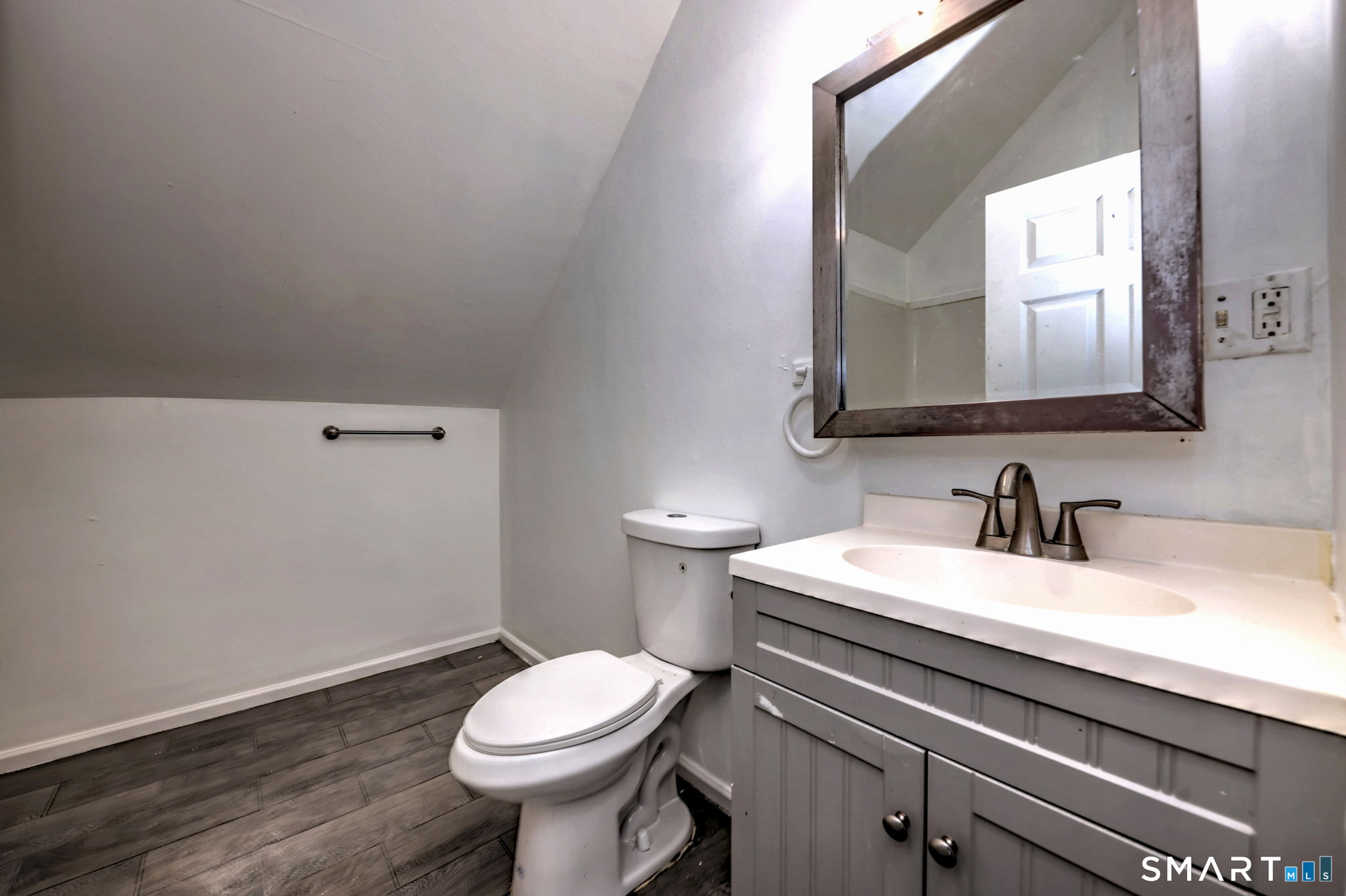 483 Ferry Street, Unit 3 New Haven, CT 06513 - Photo 27 of 28 a bathroom with a sink a toilet and mirror