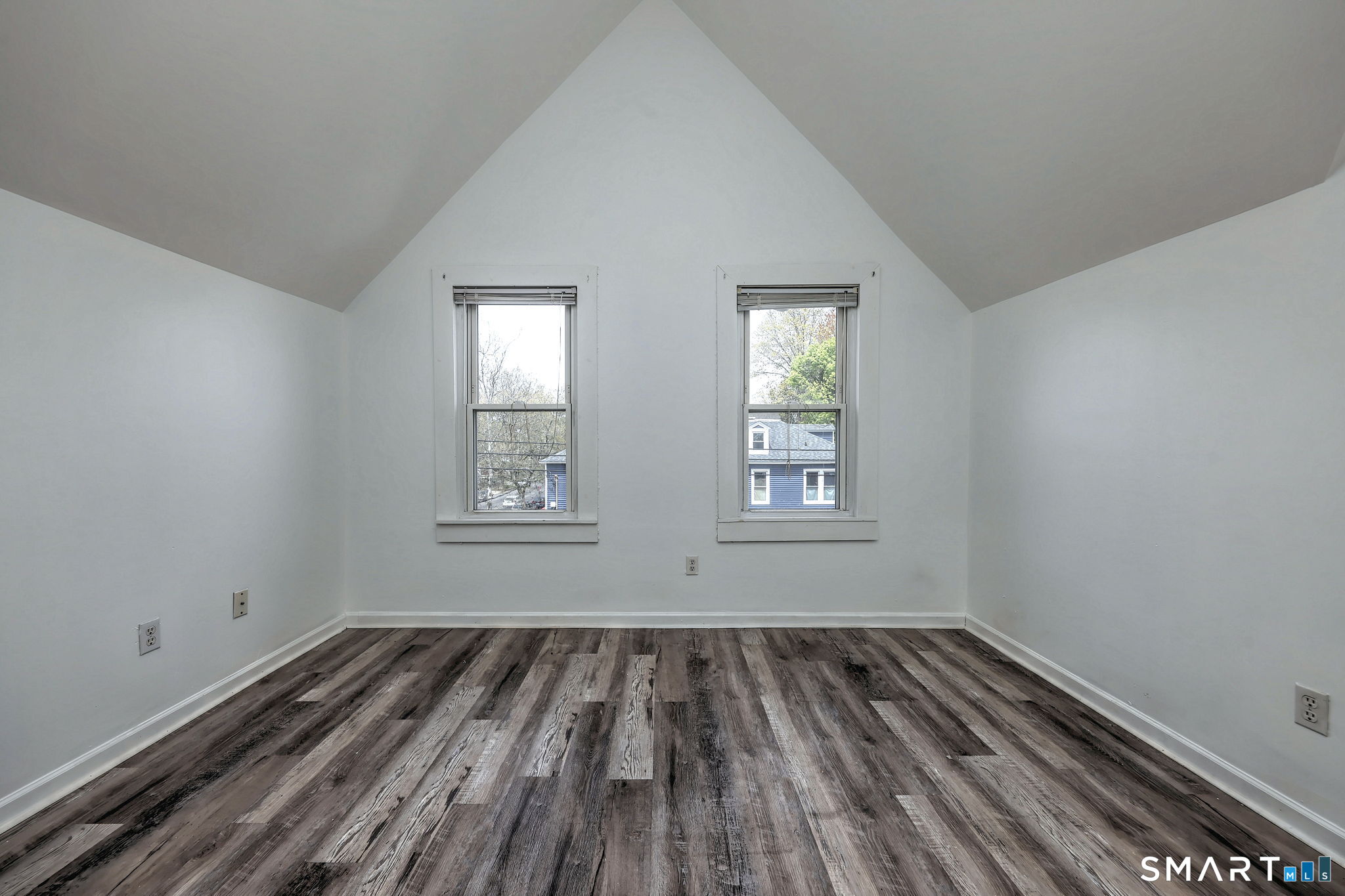 483 Ferry Street, Unit 3 New Haven, CT 06513 - Photo 10 of 28 an empty room with wooden floor and windows