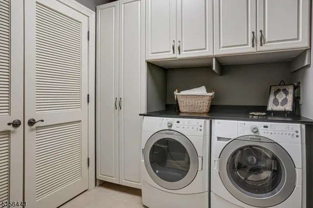 a view of a kitchen with washer and dryer