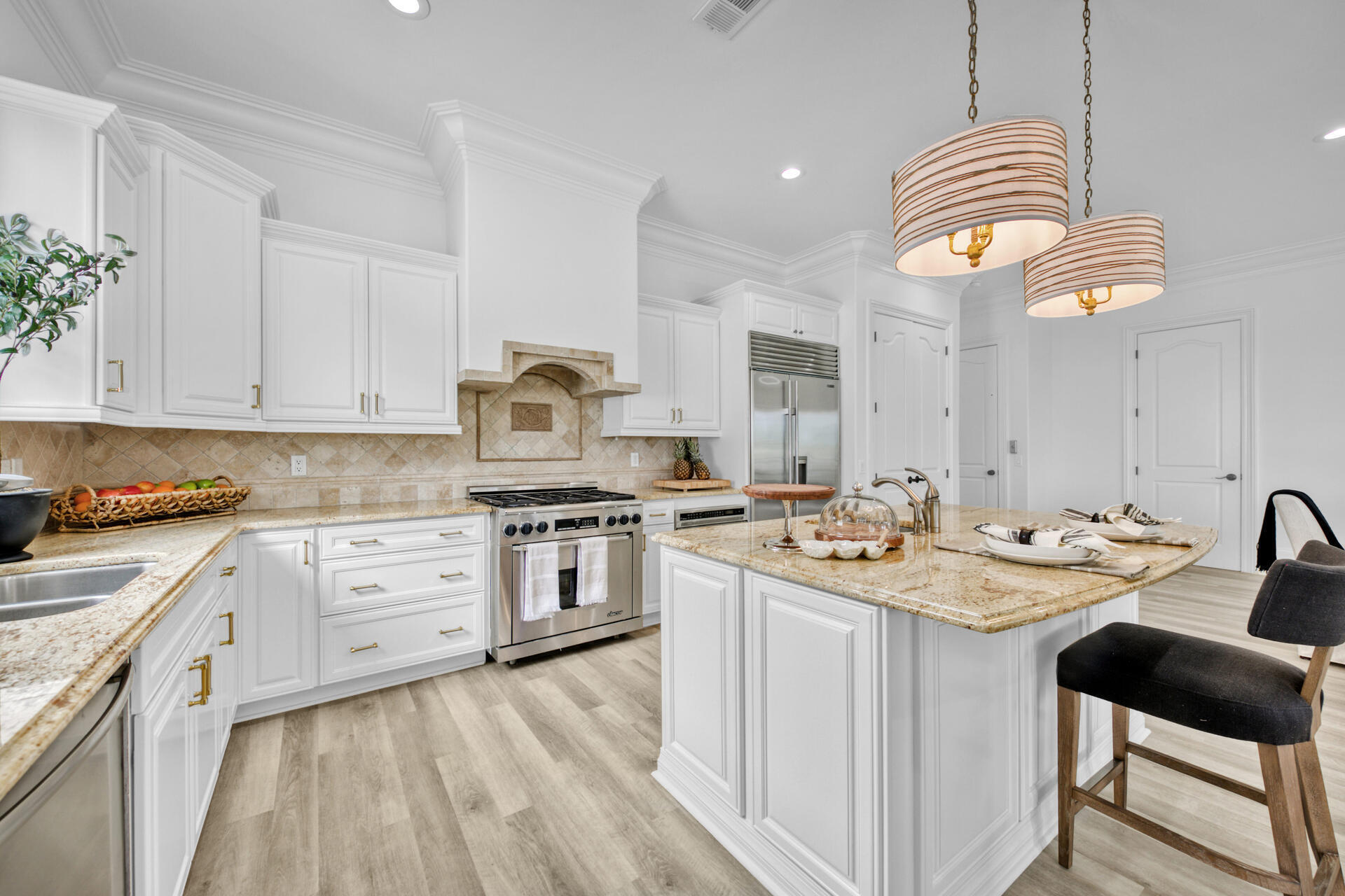 48 Sandstone Street Santa Rosa Beach, FL 32459 - Photo 16 of 78 a kitchen with a sink stove and cabinets