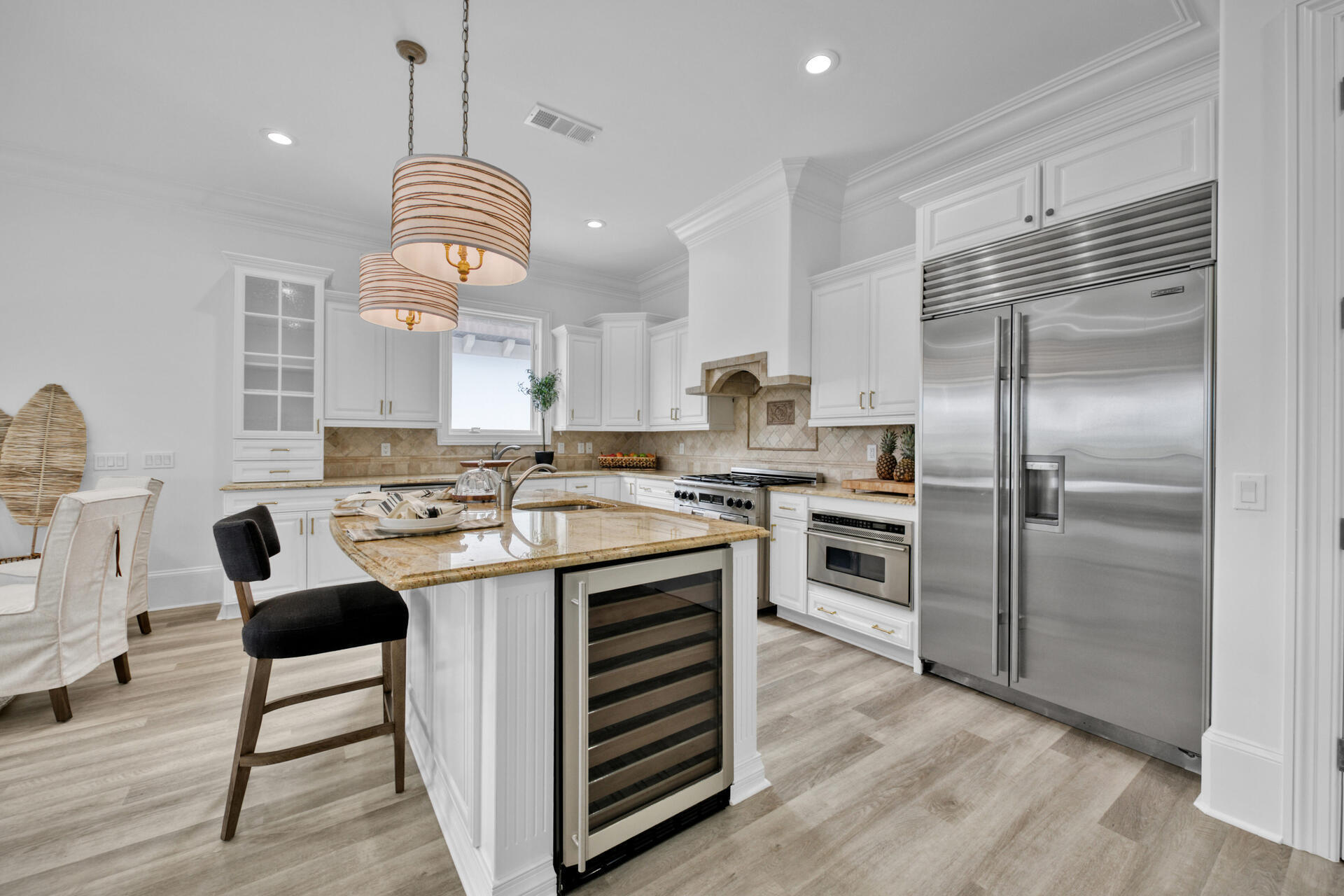 48 Sandstone Street Santa Rosa Beach, FL 32459 - Photo 17 of 78 a kitchen with kitchen island a counter space a sink appliances and cabinets