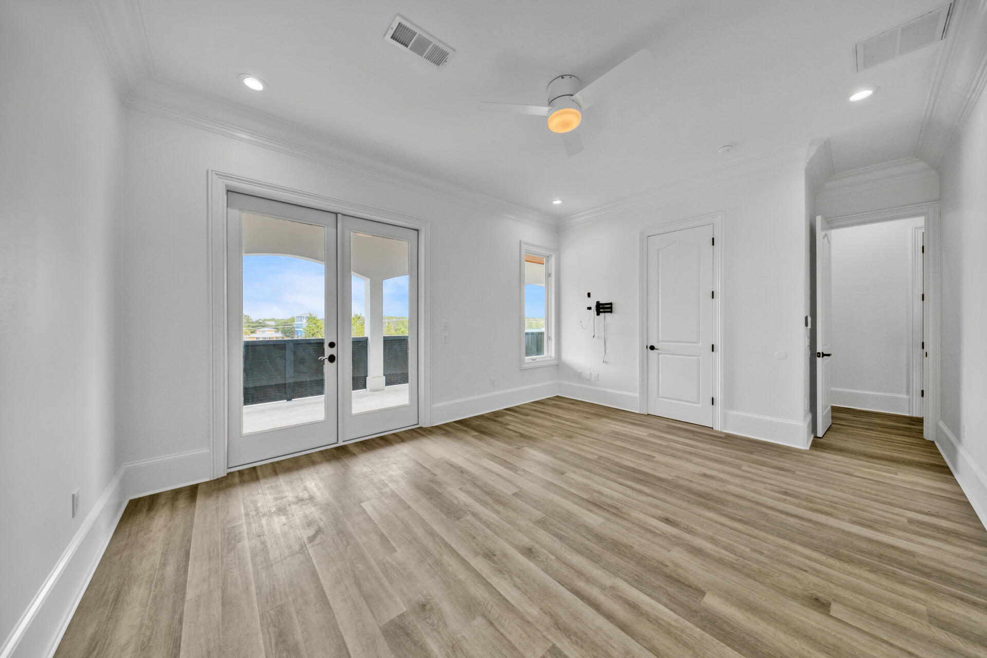 48 Sandstone Street Santa Rosa Beach, FL 32459 - Photo 31 of 78 a view of an empty room with wooden floor and a window