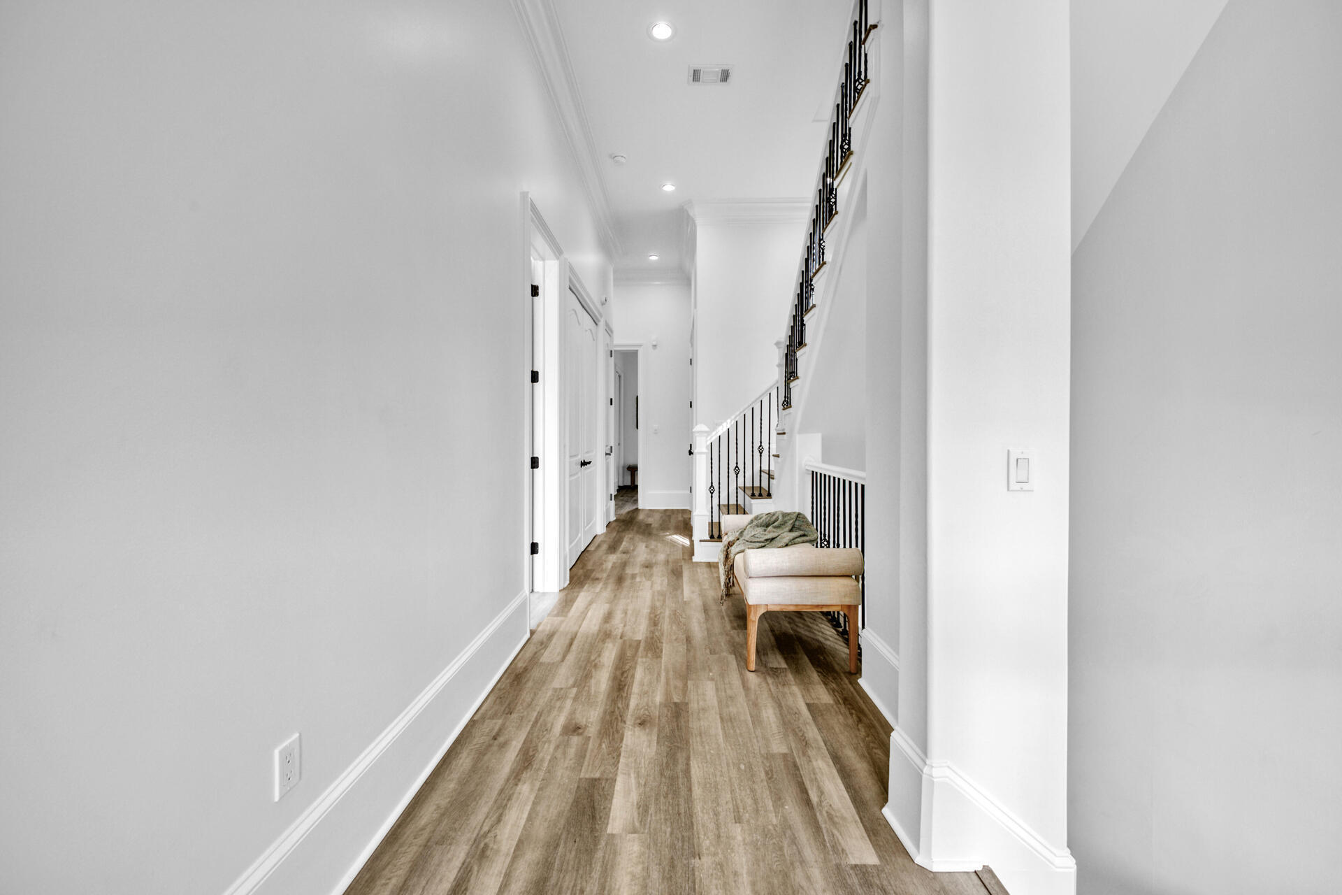 48 Sandstone Street Santa Rosa Beach, FL 32459 - Photo 32 of 78 a view of a bedroom with wooden floor and staircase