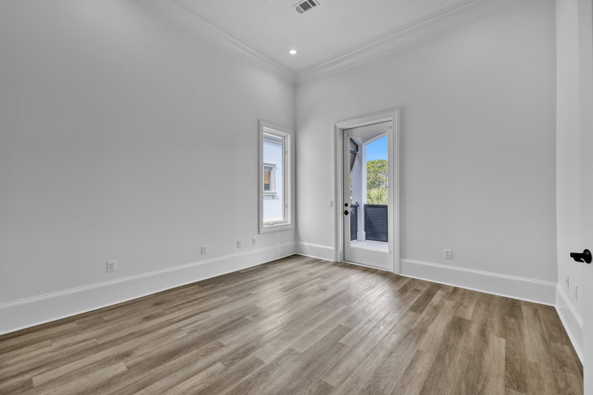 48 Sandstone Street Santa Rosa Beach, FL 32459 - Photo 33 of 78 wooden floor in an empty room with a window