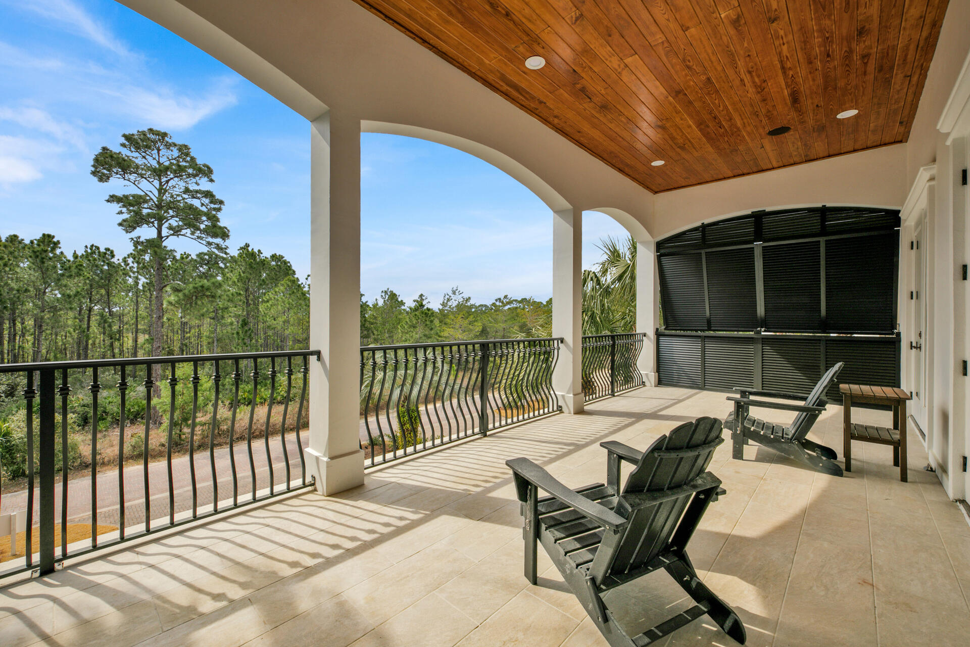 48 Sandstone Street Santa Rosa Beach, FL 32459 - Photo 38 of 78 a view of a balcony with chairs and wooden fence
