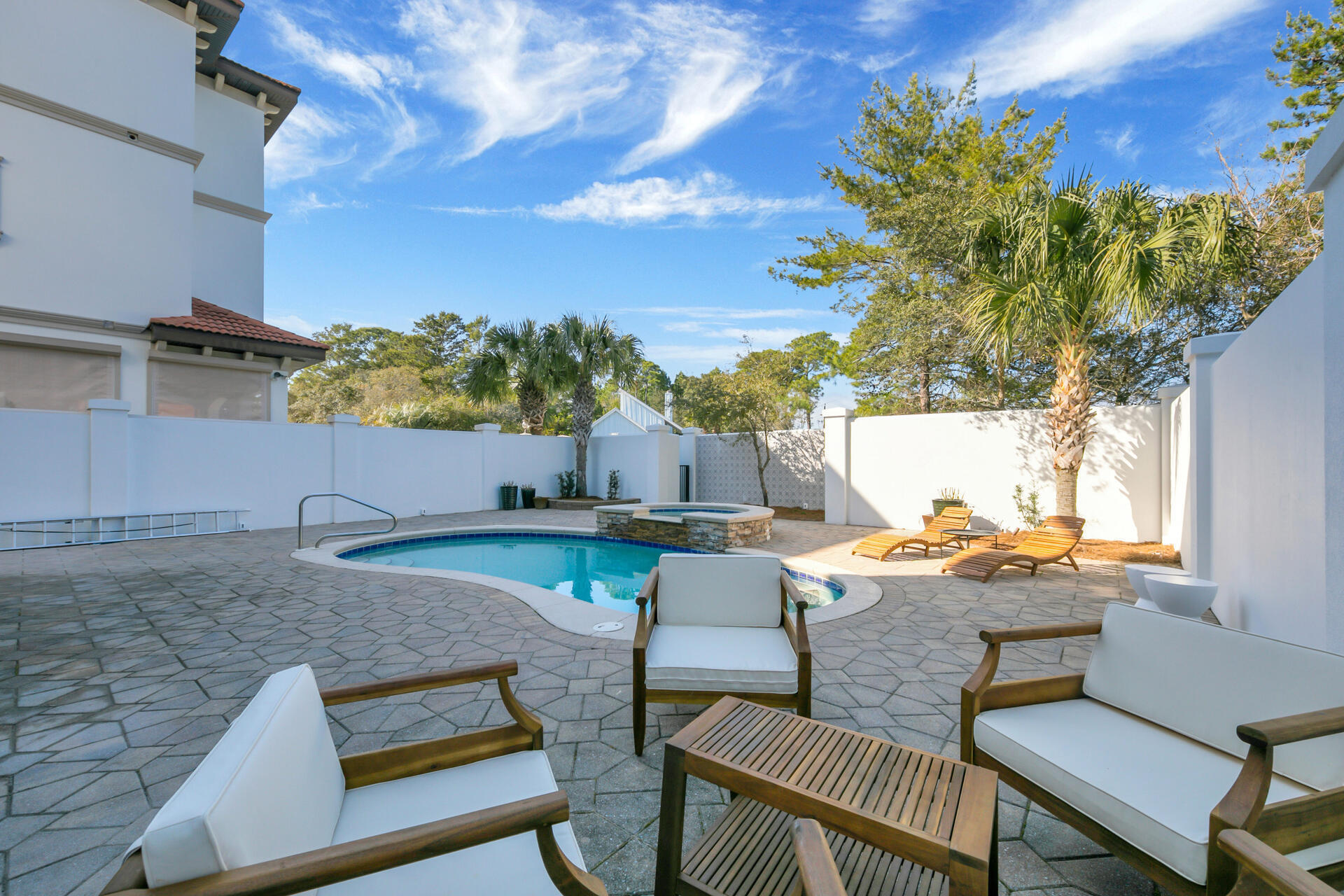 48 Sandstone Street Santa Rosa Beach, FL 32459 - Photo 53 of 78 a backyard of a house with table and chairs