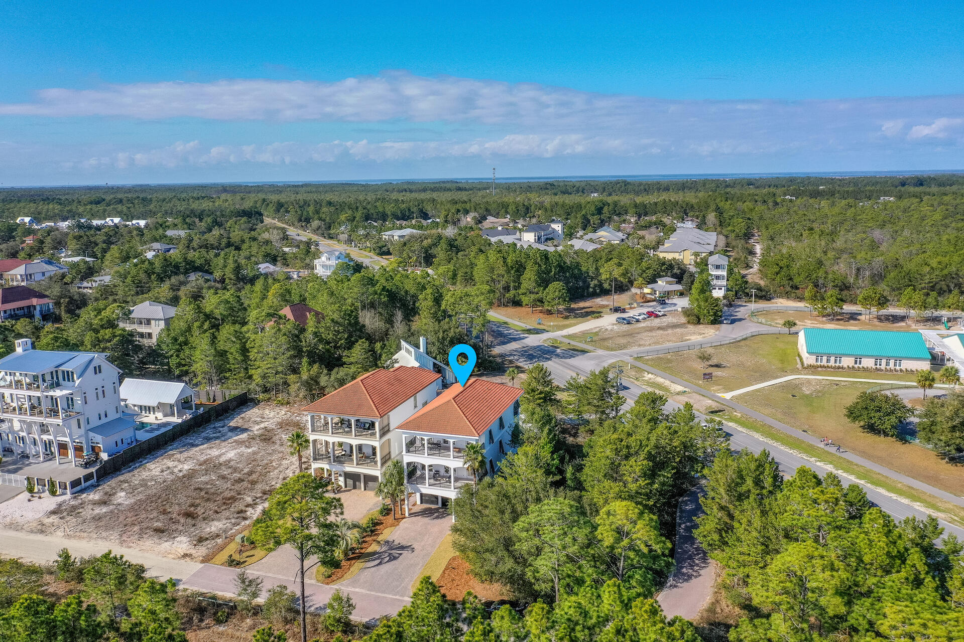 48 Sandstone Street Santa Rosa Beach, FL 32459 - Photo 73 of 78 an aerial view of a city with lots of residential buildings ocean and mountain view in back