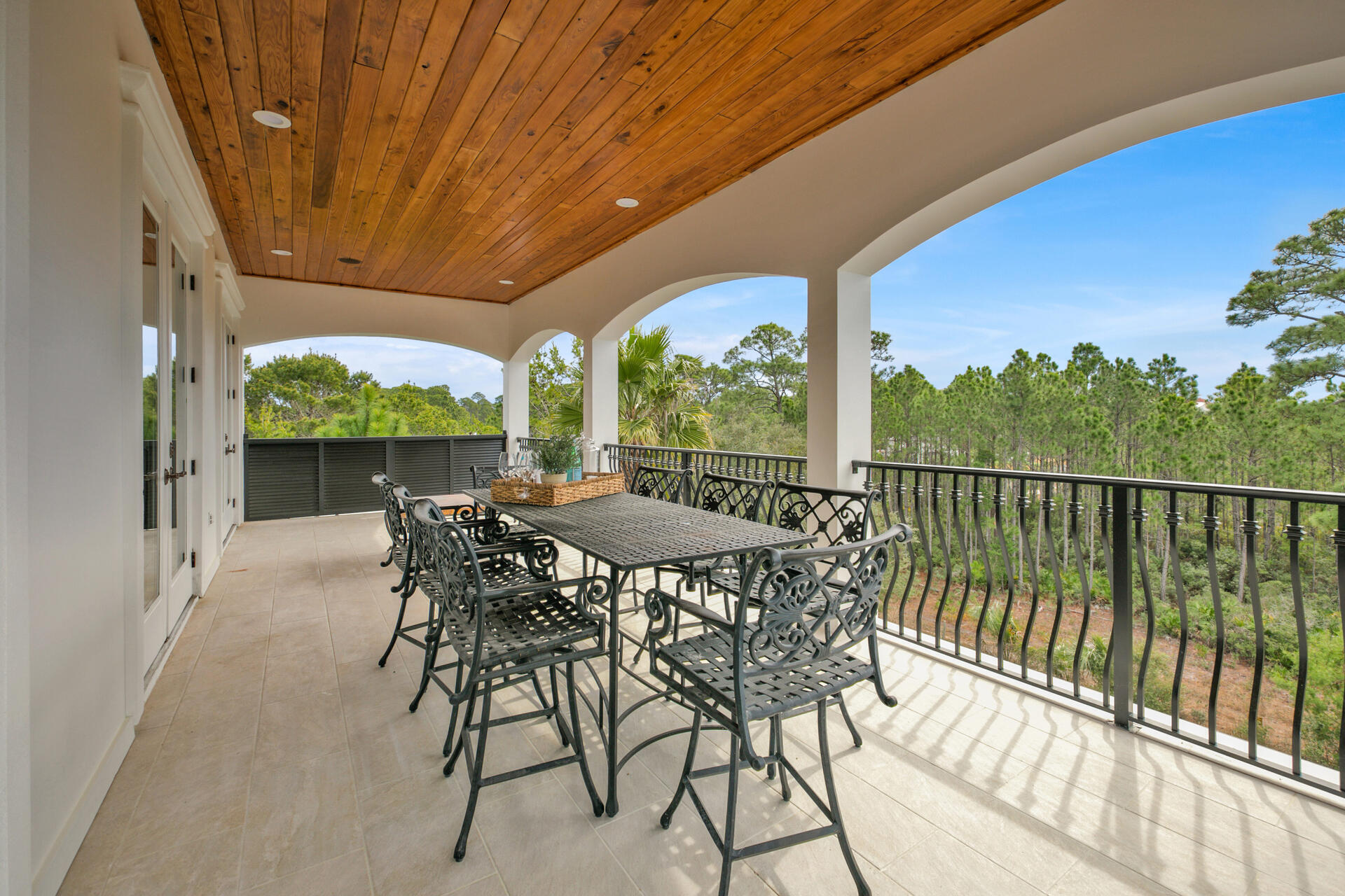 48 Sandstone Street Santa Rosa Beach, FL 32459 - Photo 8 of 78 a view of a patio with a table chairs and a backyard
