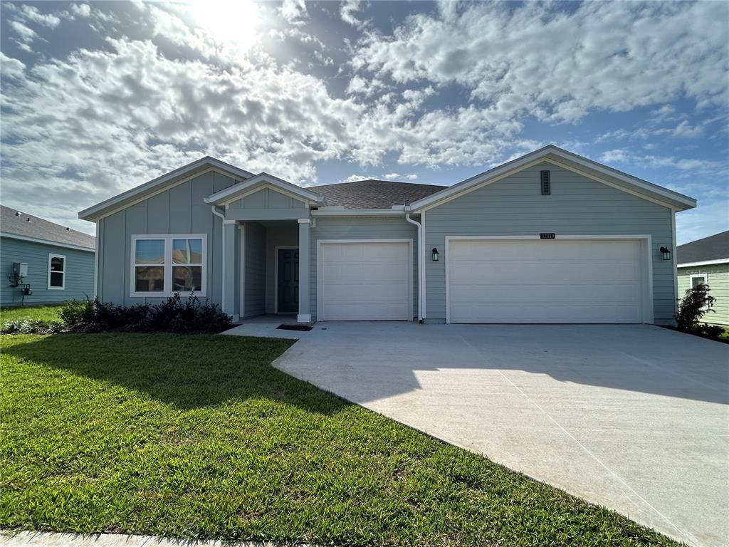 12419 Northwest 139th Court Alachua, FL 32615 - Photo 1 of 38 a front view of house with yard and green space