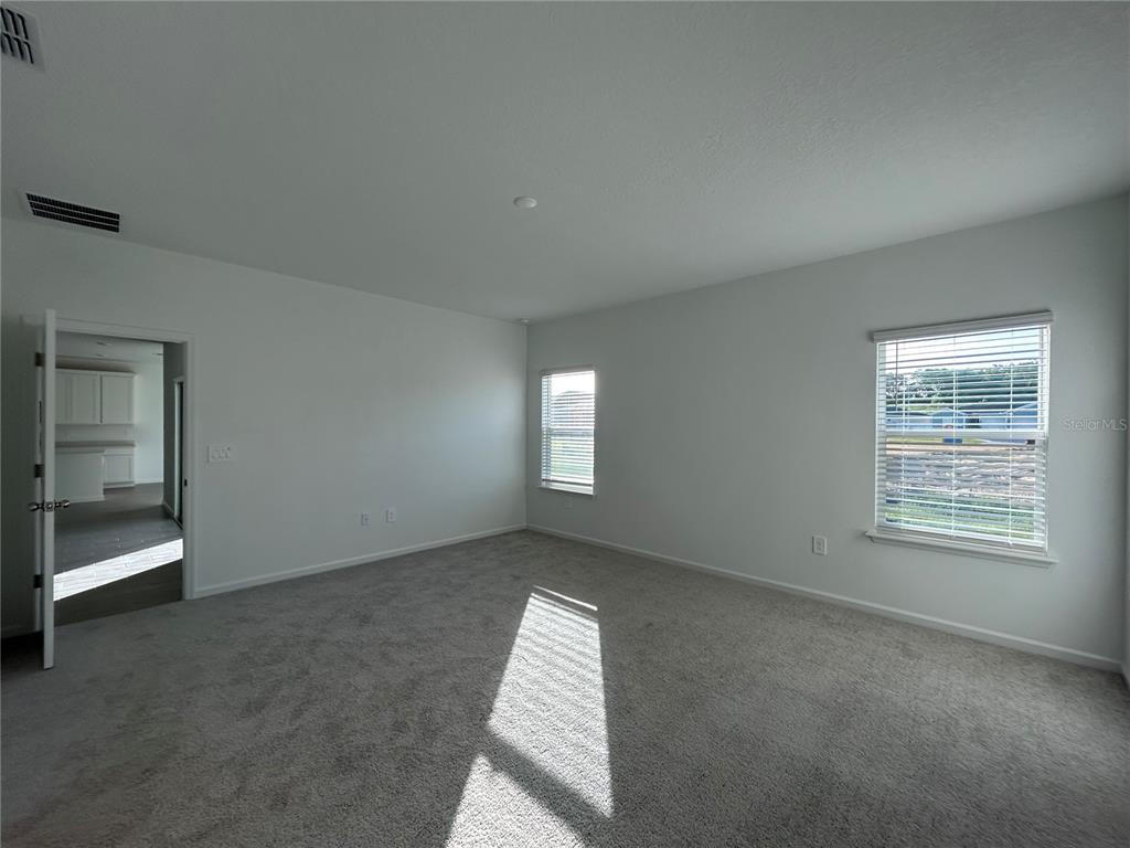 12419 Northwest 139th Court Alachua, FL 32615 - Photo 13 of 38 an empty room with windows