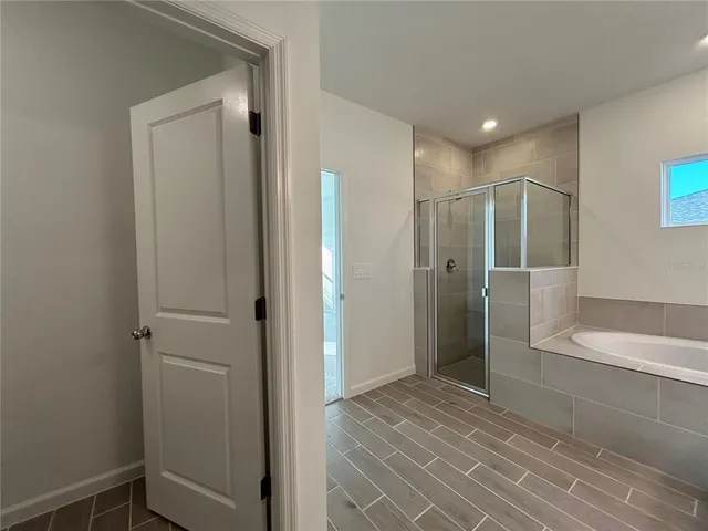 a bathroom with a shower and a sink