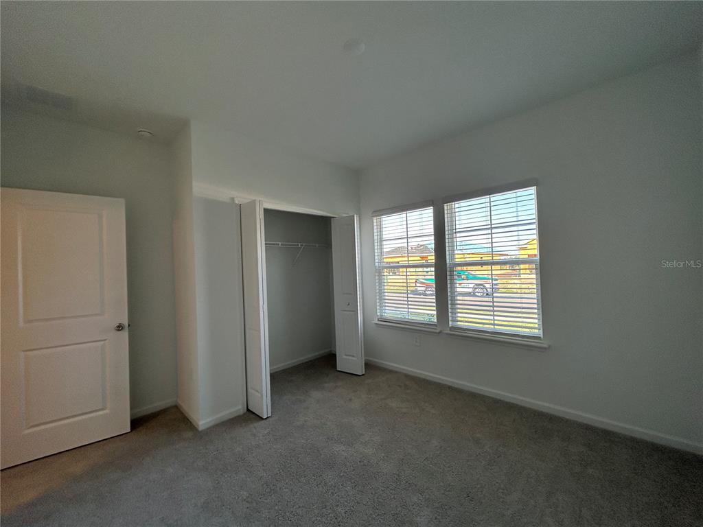 12419 Northwest 139th Court Alachua, FL 32615 - Photo 21 of 38 an empty room with windows