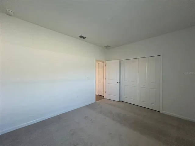 wooden floor and window in an empty room