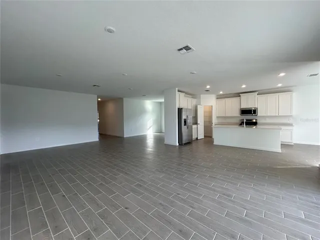 a view of a kitchen with a sink and a stove top oven