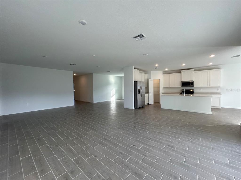 12419 Northwest 139th Court Alachua, FL 32615 - Photo 3 of 38 a view of a kitchen with a sink and a stove top oven