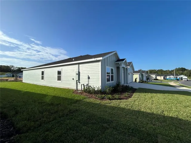 a view of a swimming pool with lounge chairs