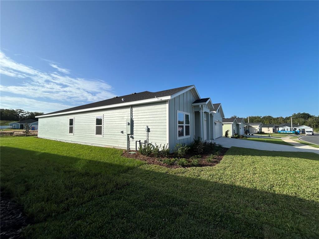12419 Northwest 139th Court Alachua, FL 32615 - Photo 36 of 38 a front view of a house with garden