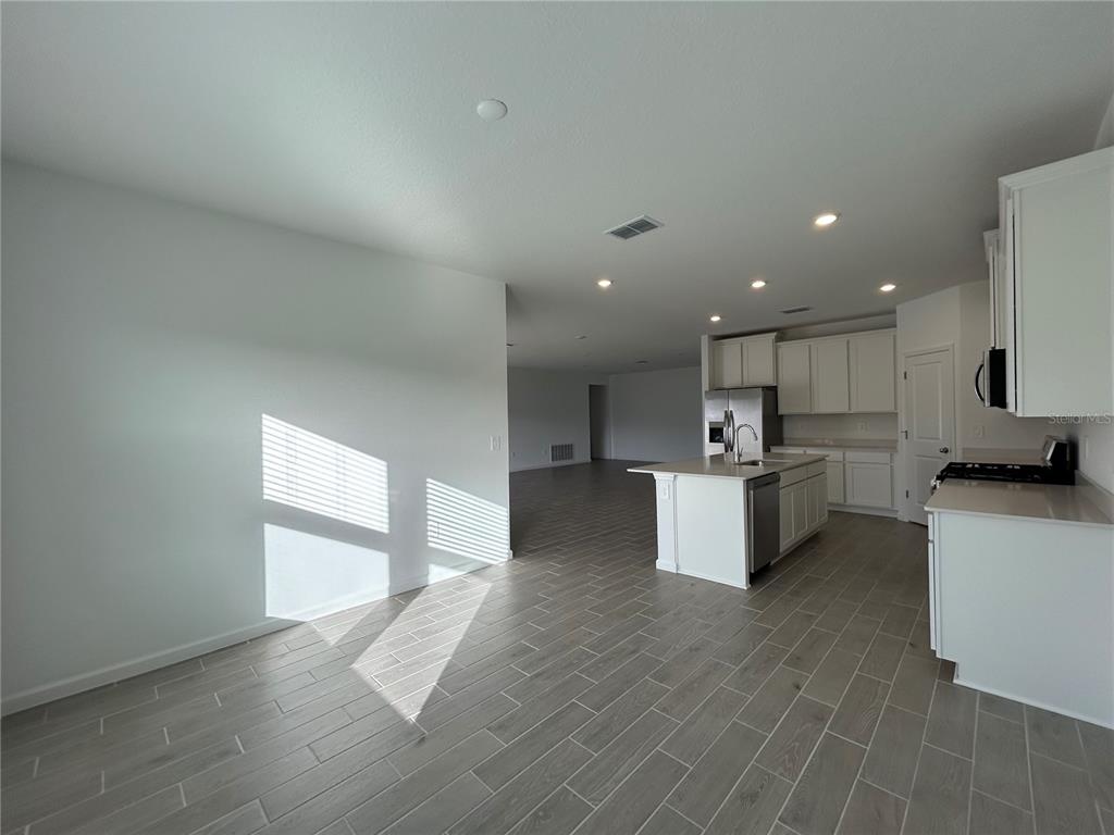 12419 Northwest 139th Court Alachua, FL 32615 - Photo 8 of 38 a view of kitchen with kitchen island sink and center island